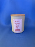 Candle in a gray container with a wooden lid on a blue background