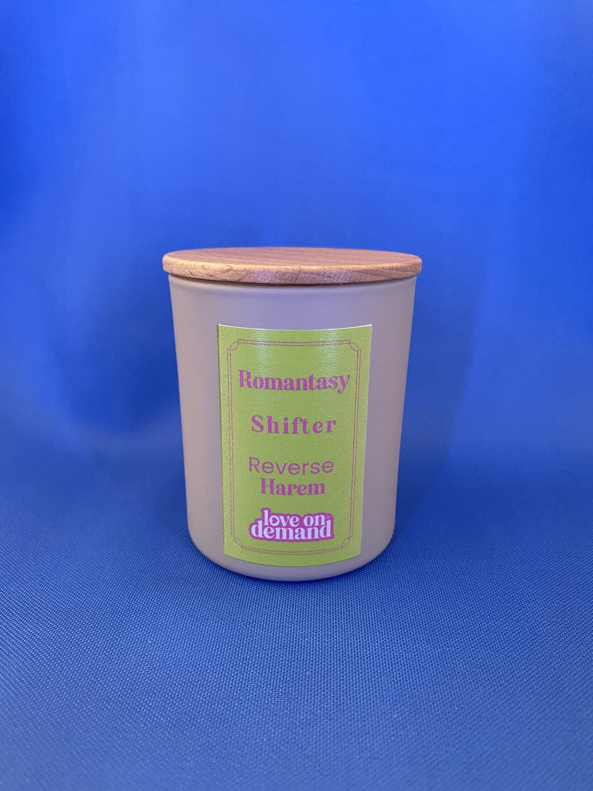 Candle with a green label on a blue background