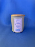 Candle jar with a wooden lid and label on a blue background